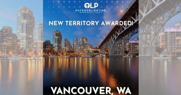 Outdoor Lighting Perspectives Vancouver WA territory award announcement featuring illuminated city skyline and bridge at night