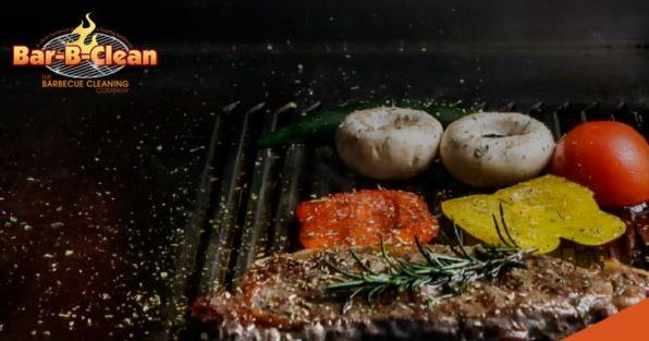 Bar-B-Clean franchise grilled steak and vegetables on barbecue, highlighting professional grill cleaning services