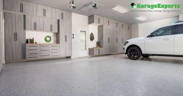GarageExperts franchise garage transformation featuring custom storage cabinets and high-performance epoxy flooring