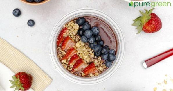 Pure Green franchise acai bowl topped with fresh fruit and granola, highlighting healthy smoothie and juice offerings