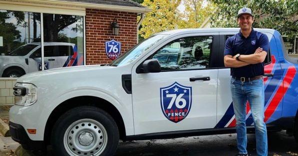 76 Fence franchise owner standing beside branded service truck, highlighting residential and commercial fence installation