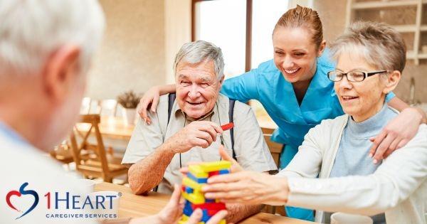 1Heart Caregiver Services franchise caregiver assisting seniors, highlighting in-home senior care and caregiver services