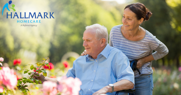 Hallmark Homecare franchise caregiver assisting senior outdoors, highlighting in-home senior care and referral services
