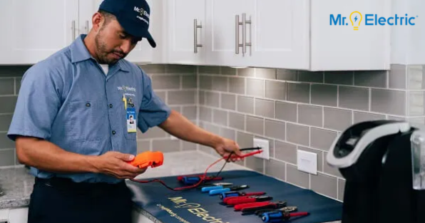 Mr. Electric franchise electrician testing electrical outlets, highlighting residential and commercial electrical services