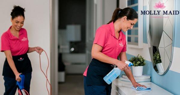 Molly Maid franchise cleaning team providing professional residential house cleaning services in a customer’s home