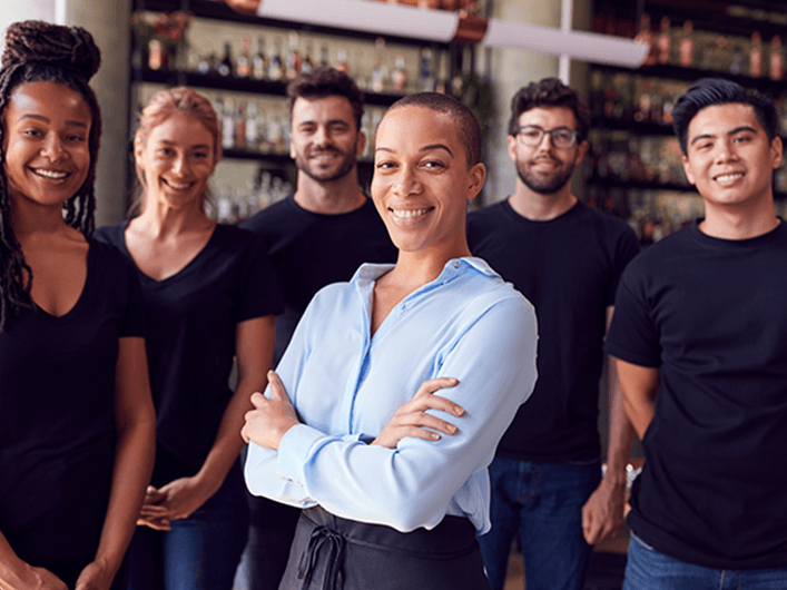 Prospective franchise owner with her team at a business
