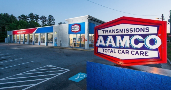 AAMCO Total Car Care franchise location exterior, automotive service center highlighting Seattle-based franchise expansion