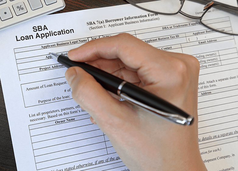 Completing an SBA loan application for franchise financing